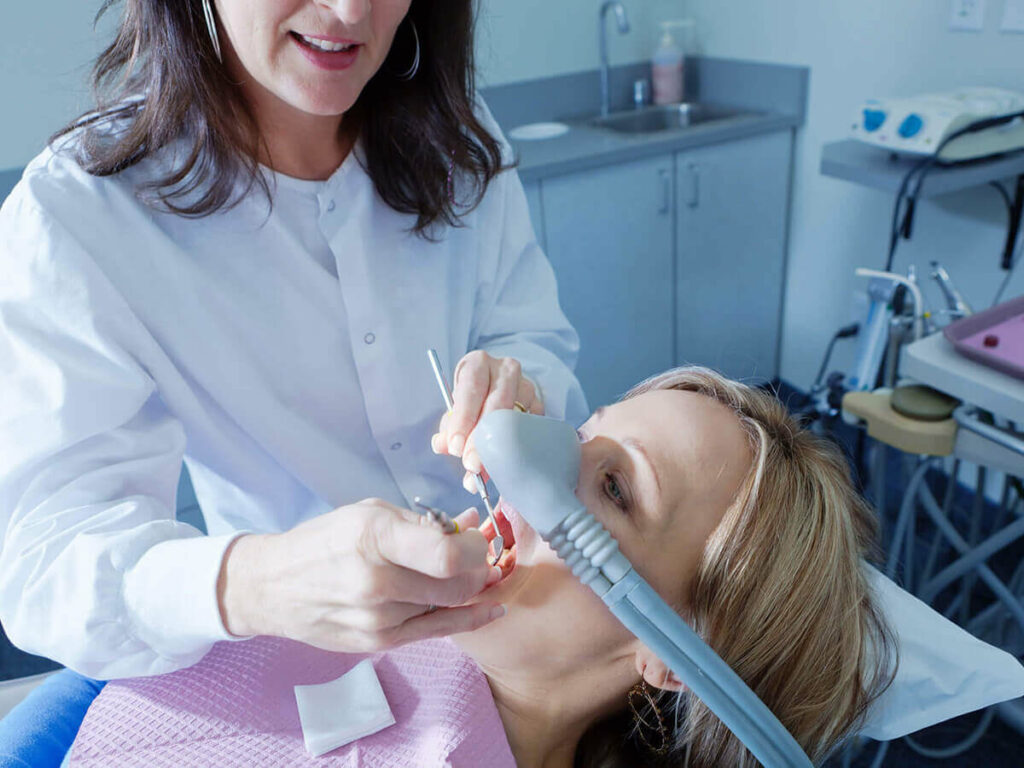 Dental patient receiving sedation and dental work